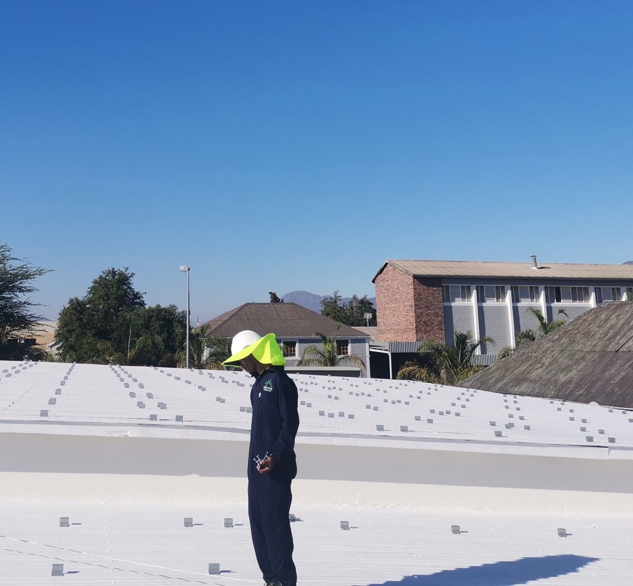 Sonop Solar preparing site for roof mounted installation.